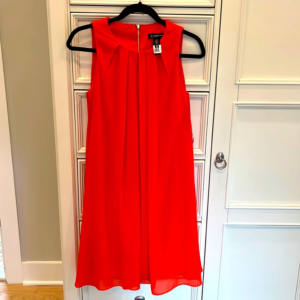 INC Dress.  Orange with Gold zipper in back.  Size 4.